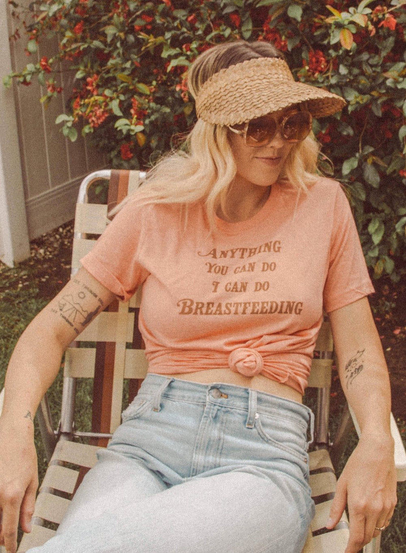 Mother sitting in lawn chair in vintage breastfeeding t shirt