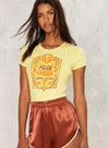 Model wearing vintage inspired yellow ribbed tee that says Moon Swoon